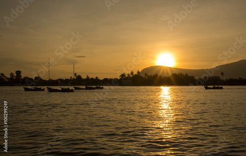 Fishing boats returning with the day's catch. Kampot, Cambodia. 