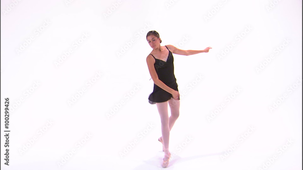 Shot of a ballerina dancing en pointe. Shot of a ballerina dancing en pointe.