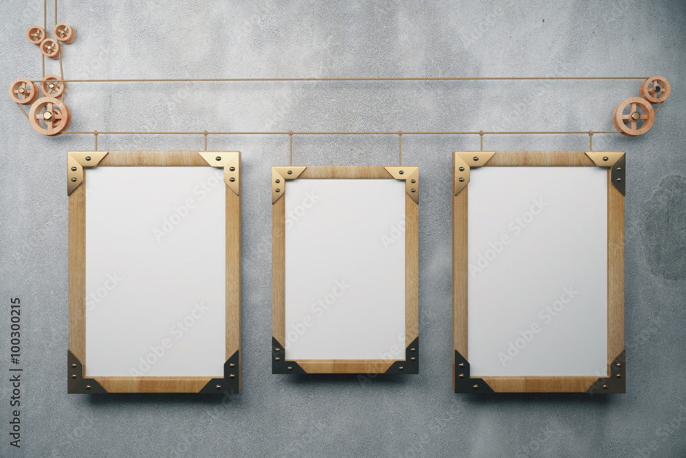 Three empty picture frame in the style of steampunk hanging on a Three empty picture frame in the style of steampunk hanging on a