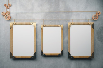 Three empty picture frame in the style of steampunk hanging on a