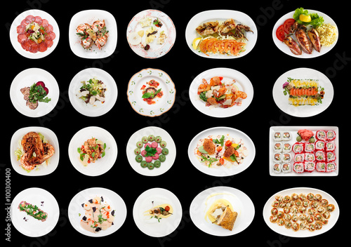 Set of various appetizers on black background