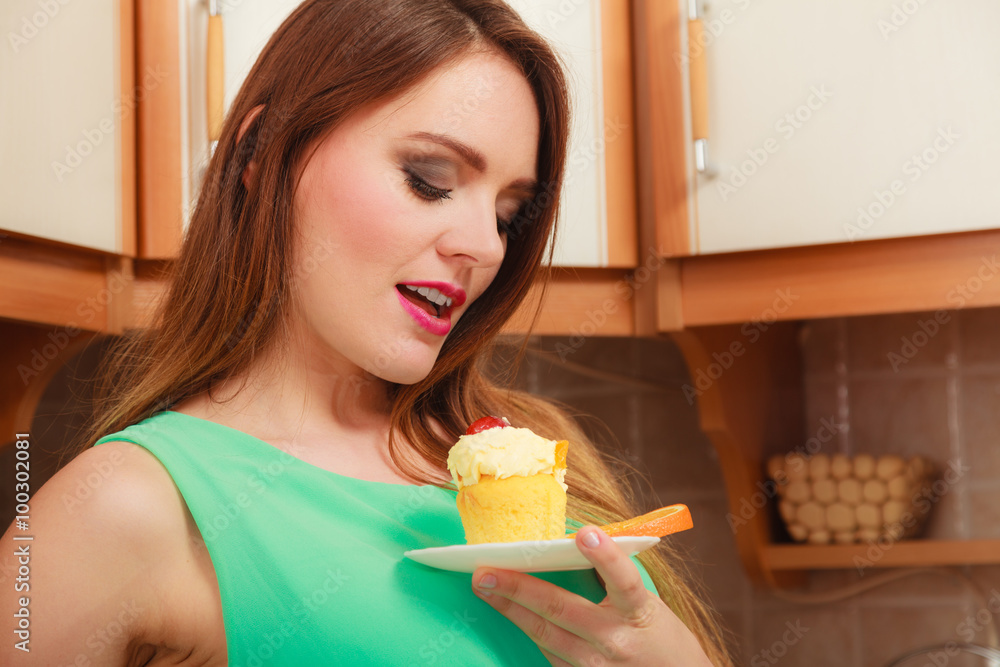 Woman holding delicious sweet cake. Gluttony. Woman holding delicious sweet cake. Gluttony.