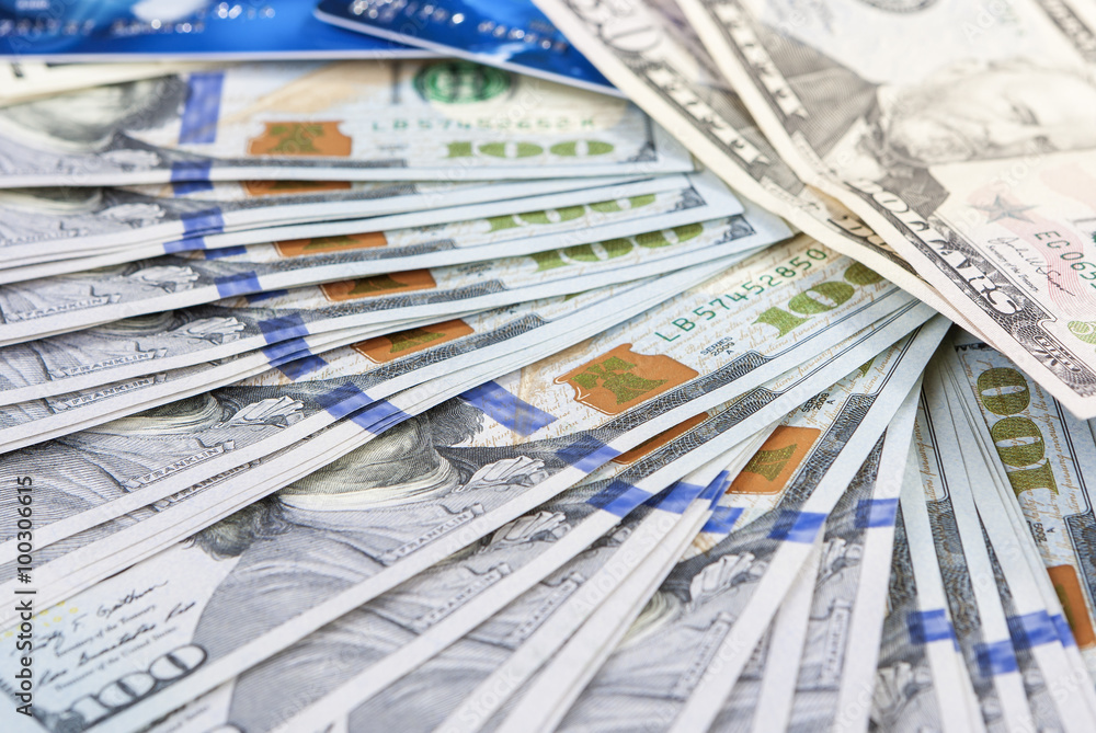 Money and Finances Concept. Plenty of US Banknotes With Plastic Card Money and Finances Concept. Plenty of US Banknotes With Plastic Card