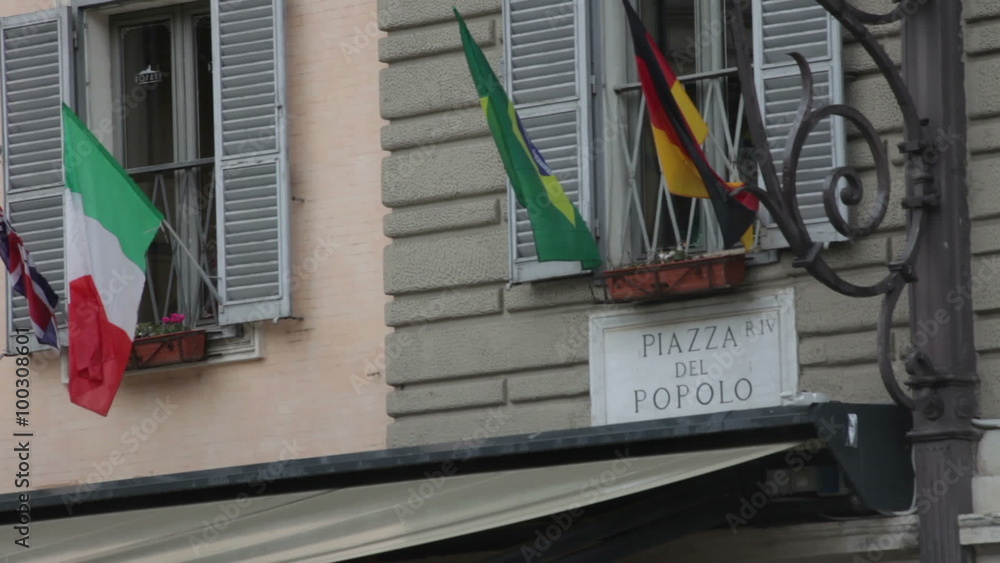 Sign titled Piazza Del Popolo above an awning Sign titled Piazza Del Popolo above an awning
