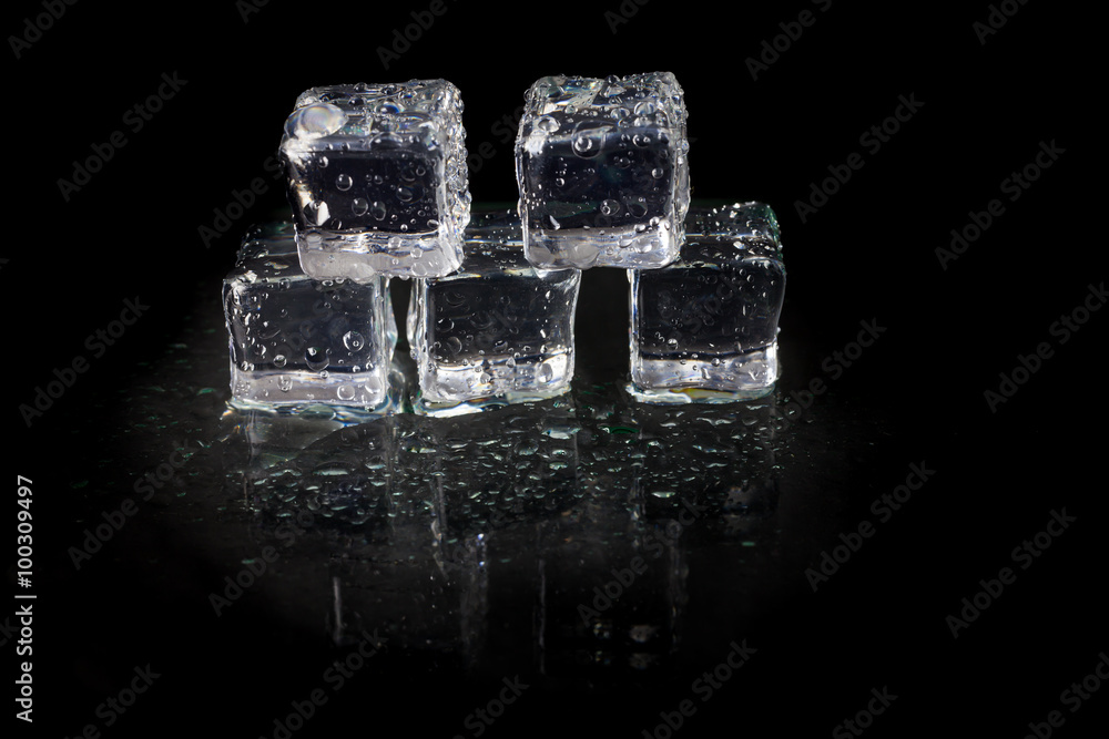 Shining ice cubes on black background. Shining ice cubes on black background.