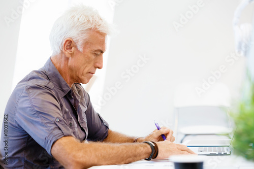 Handsome businessman in office © Sergey Nivens