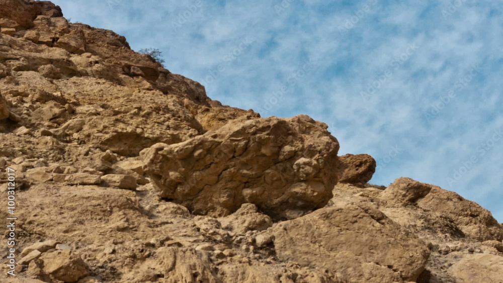 Close up time lapse of rock pile, clouds moving across sky. Cropped. Close up time lapse of rock pile, clouds moving across sky. Cropped.