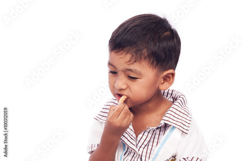 little boy eating snack food