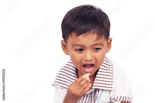 little boy eating snack food