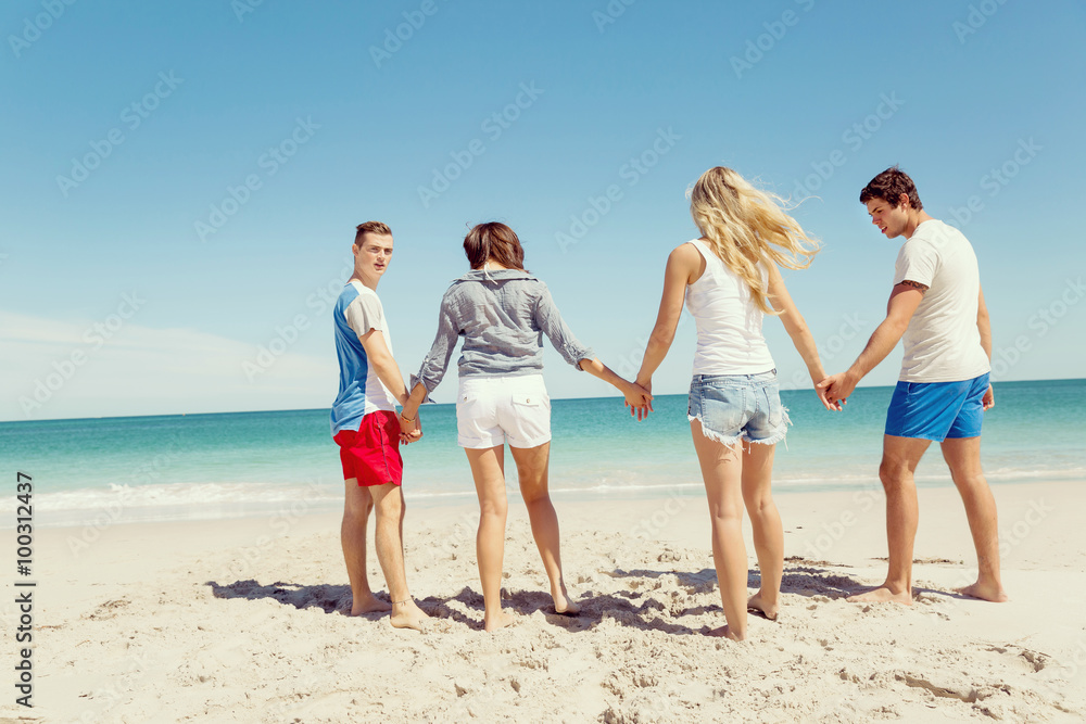 Company of young people on the beach