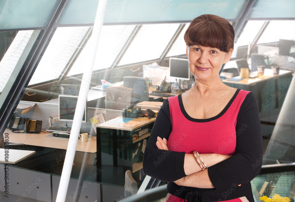 Middle age good looking woman in office. Administrative and supportive stuff