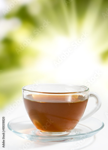 image of a cup of tea on a green background closeup