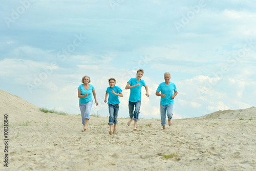 Grandparents with grandchildren on beach