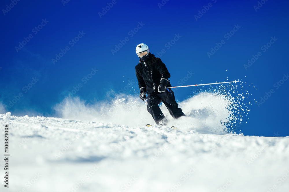 Male skier skiing at ski resort