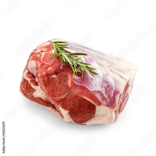 Raw lamb leg with rosemary twig