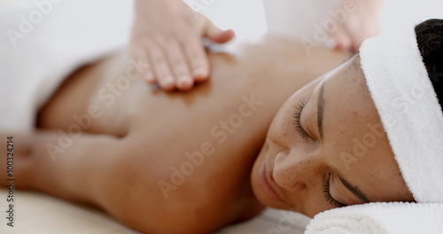 Masseur doing massage on woman body in the spa salon
