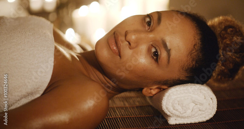 Cute african american woman relaxing in spa slow motion
