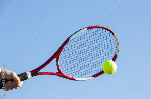 Tennis player hitting the ball © 135pixels