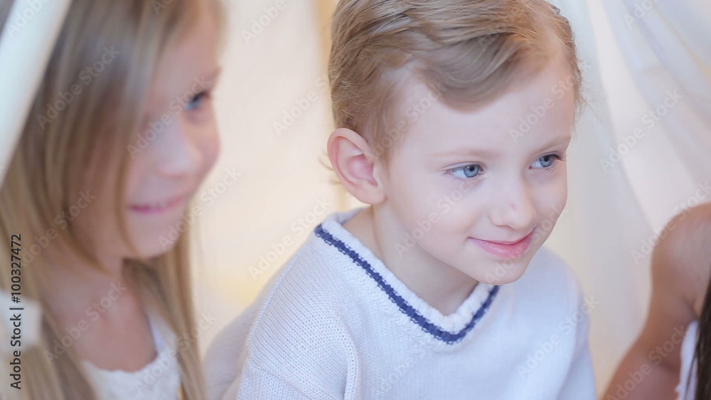 Beautiful blue-eyed boy and a cute little girl Beautiful blue-eyed boy and a cute little girl