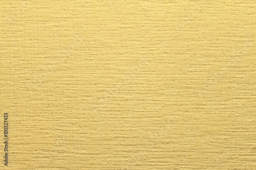 Yellow non-woven wallpaper for painting. Yellow, orange background abstract design texture. 