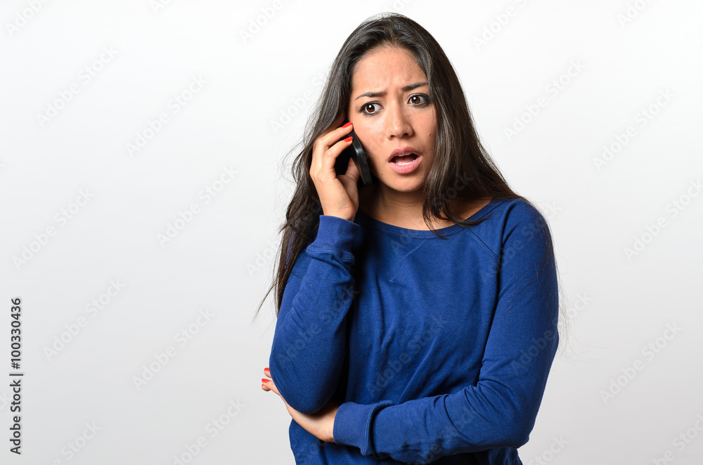 Young woman receiving bad news on her mobile Young woman receiving bad news on her mobile