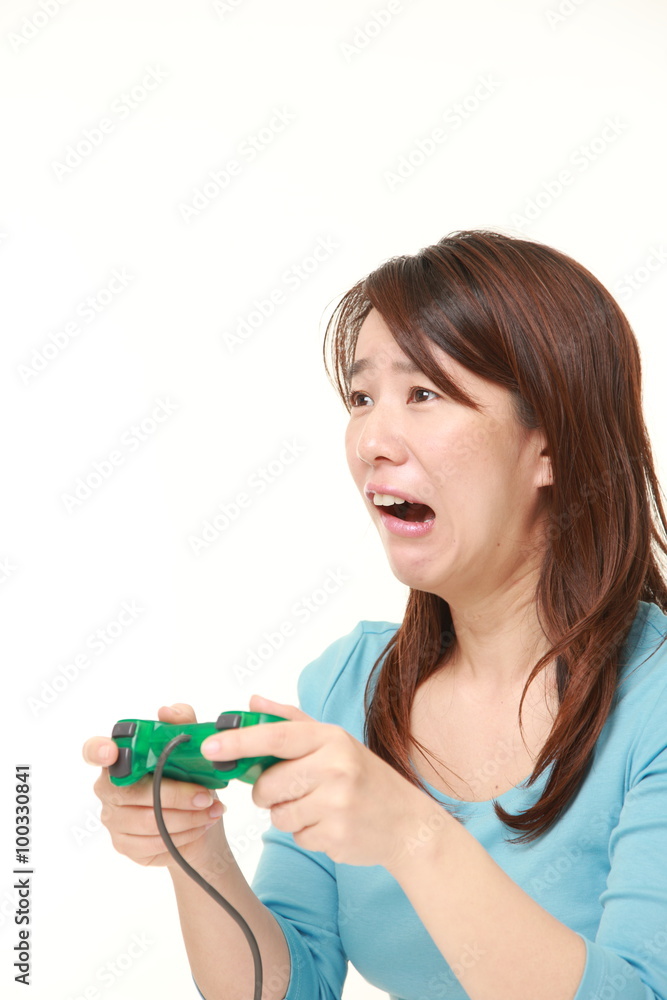 Japanese woman losing playing video game Japanese woman losing playing video game