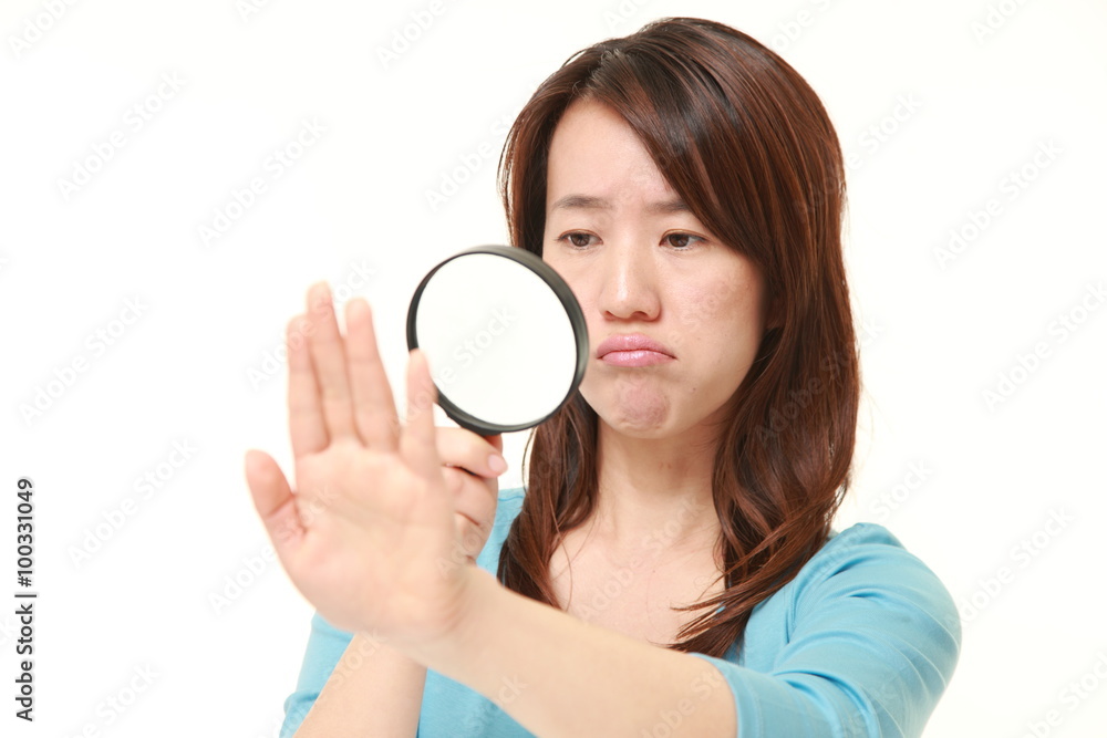 shocked woman looking through a magnifying glass her nails shocked woman looking through a magnifying glass her nails