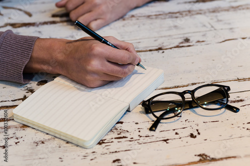 Foto writing in notebook