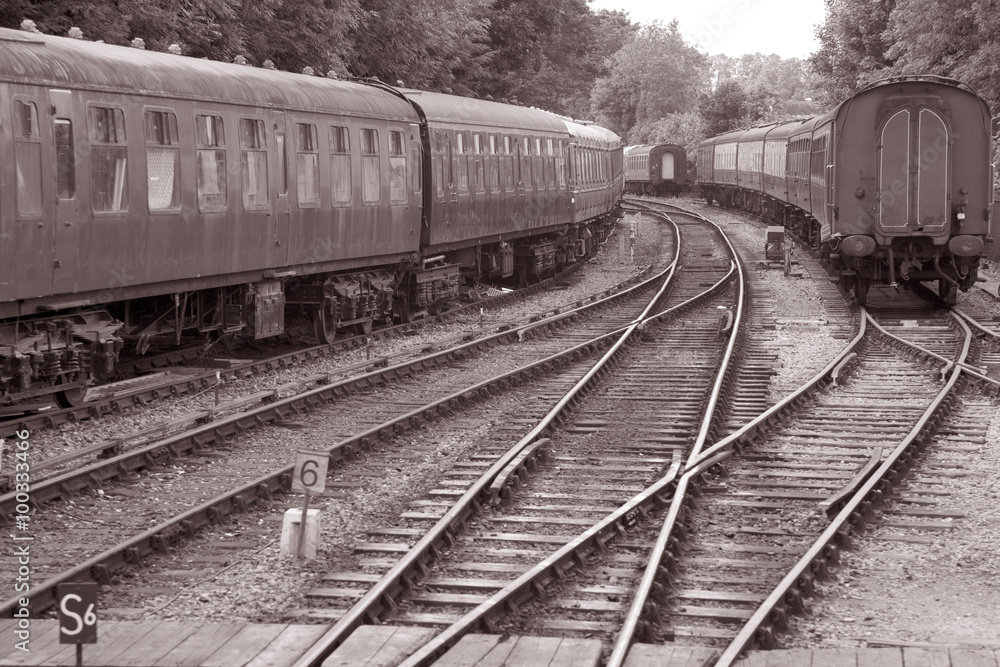 Railway Track with Train Carriages in Black and White Sepia Tone