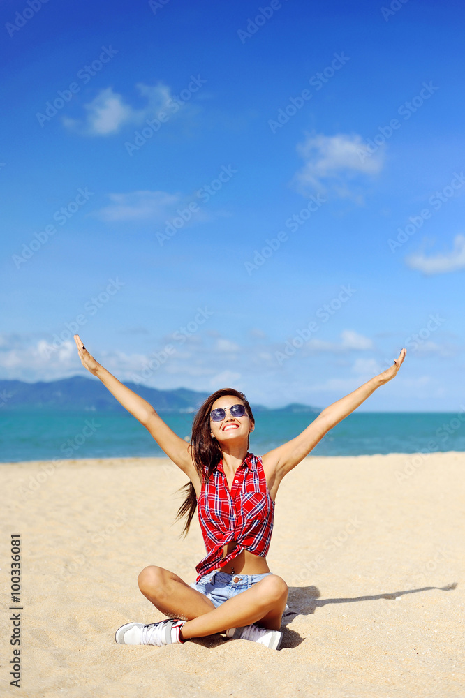 Beautiful happy girl with hands raised looking to the sun behind Beautiful happy girl with hands raised looking to the sun behind