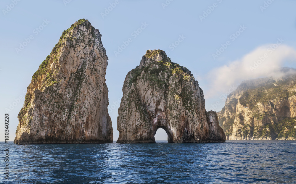Amazing landscape at Capri Island with Faraglioni - coastal rocks formation at the Mediterranean Sea.