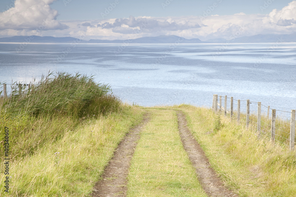 Track down to Sea at Tulm Bay, Isle of Skye, looking out to the Outer Hebrides, Scotland, UK