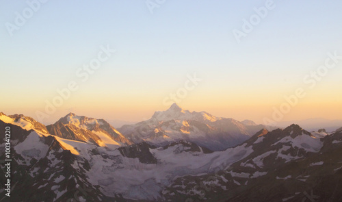 Panorama of mountain peaks in the setting sun  the majesty and b