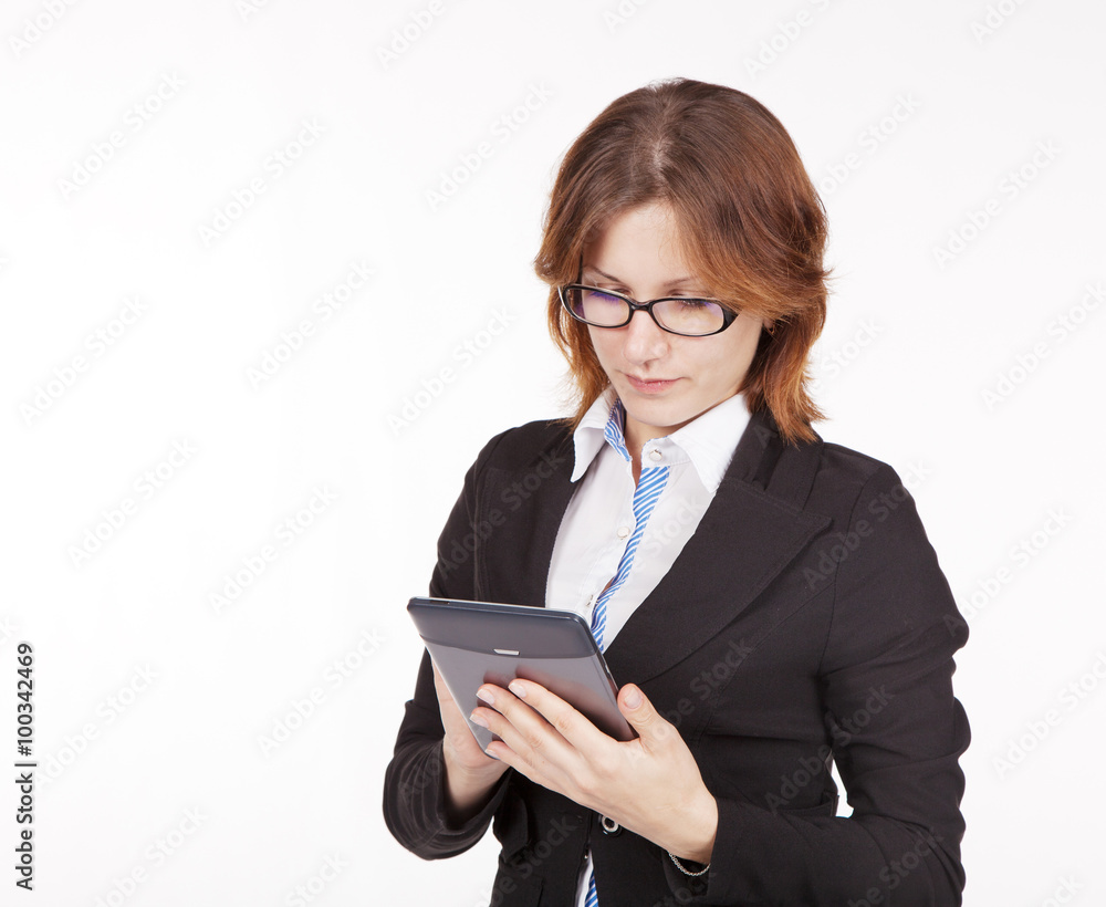 business woman with glasses looking at the tablet display business woman with glasses looking at the tablet display