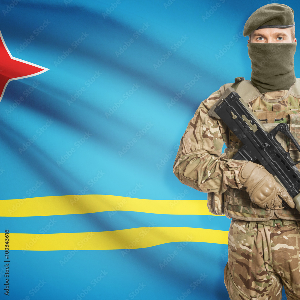 Soldier with machine gun and flag on background - Aruba Soldier with machine gun and flag on background - Aruba