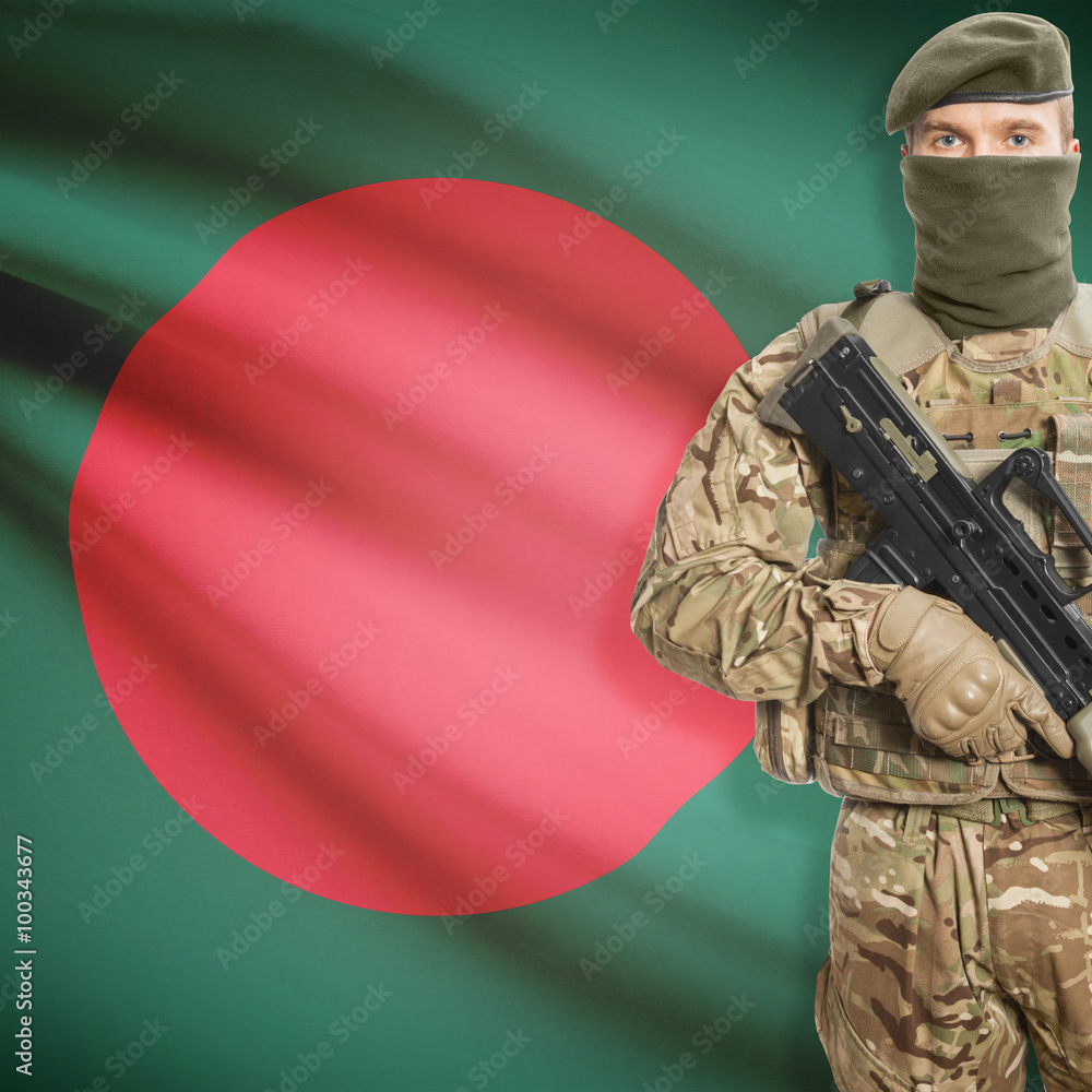 Fototapeta premium Soldier with machine gun and flag on background - Bangladesh