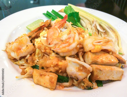Stir-fried Rice Noodles (Pad Thai) with Shrimp and Squid in White Plate