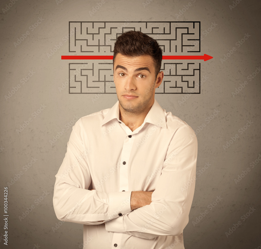 Handsome business guy solving maze Handsome business guy solving maze
