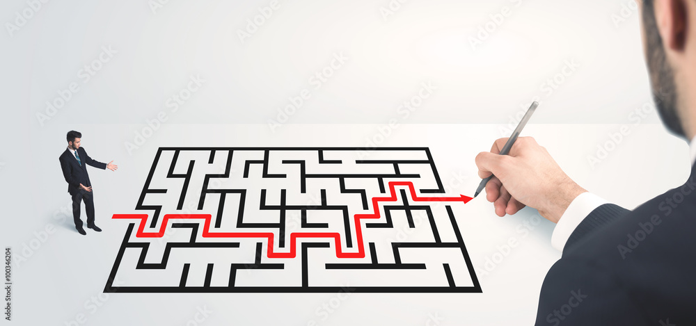 Business man looking at hand drawing solution Business man looking at hand drawing solution