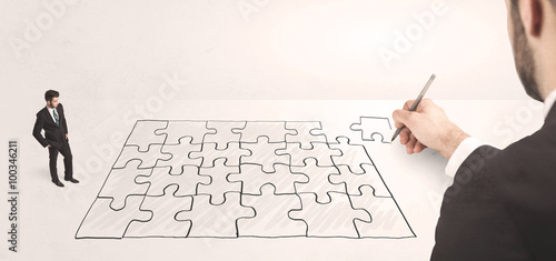 Business man looking at hand drawing solution