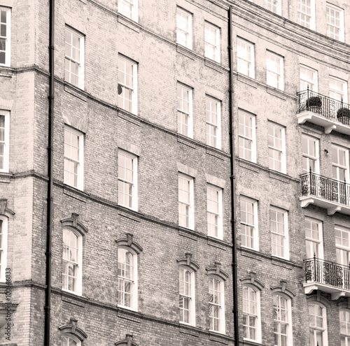 window in europe london old red brick wall and historical