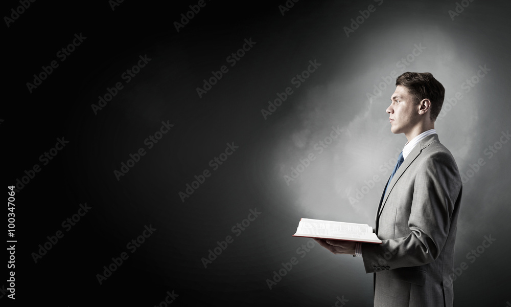 Businessman with opened book Businessman with opened book