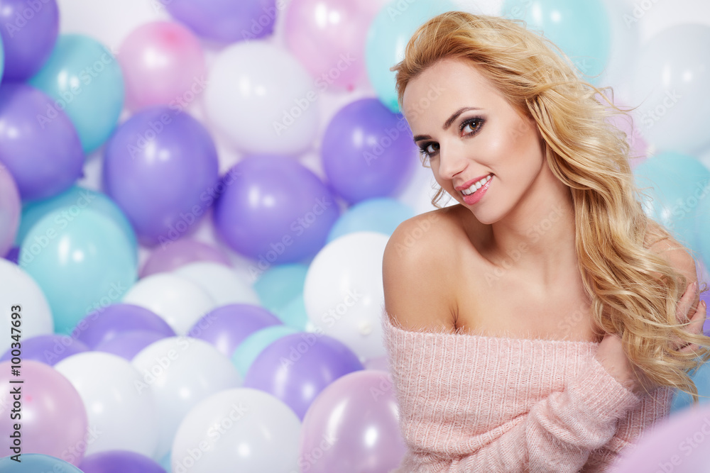 Happy young woman with colorful latex balloons Happy young woman with colorful latex balloons