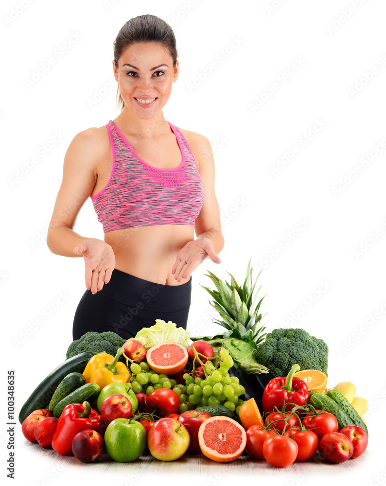 Young woman with variety of organic vegetables and fruits Young woman with variety of organic vegetables and fruits
