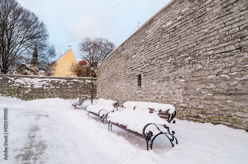Bench and street lamp in the park winter Old Tallinn