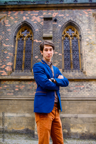 man in beige pants and a blue blazer