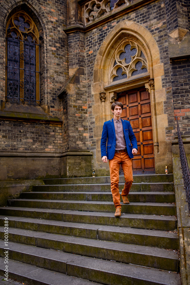 man in beige pants and a blue blazer