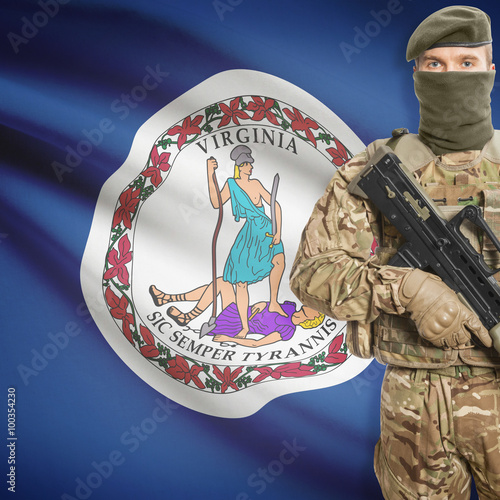 Soldier with machine gun and USA state flag on background - Virginia