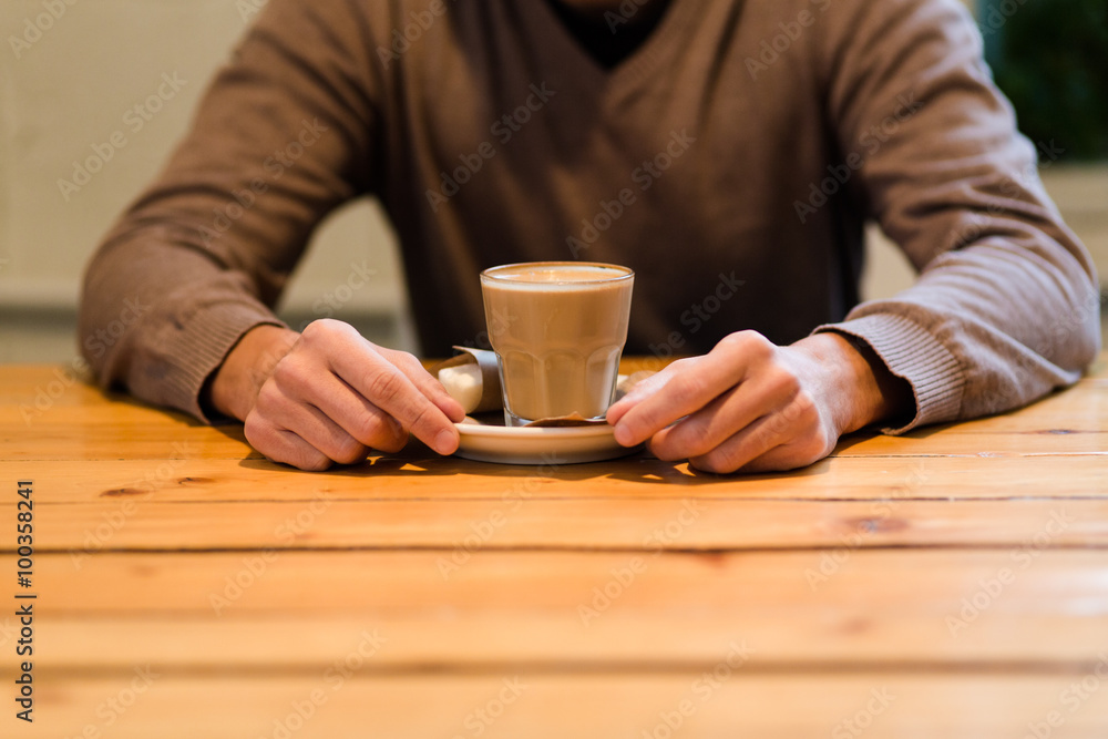 male hands with cup of  coffee