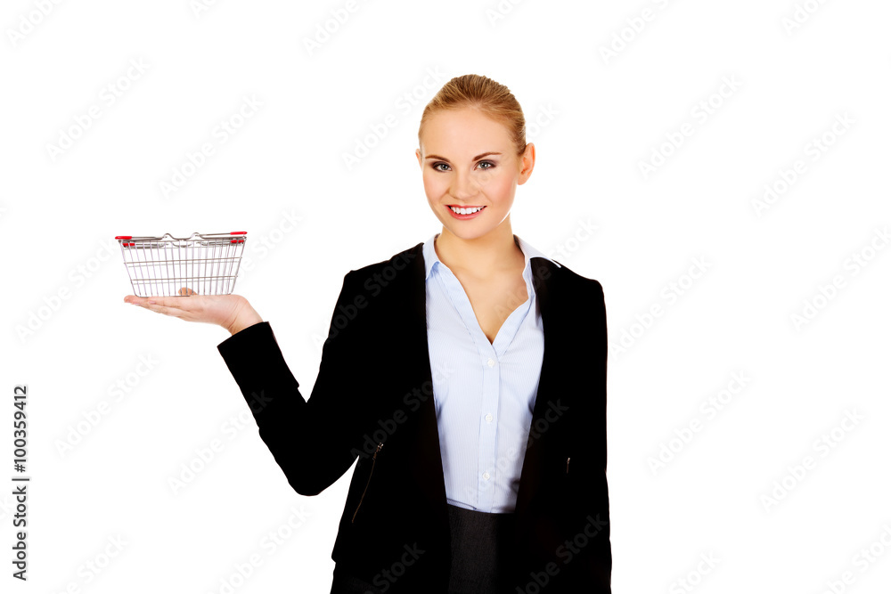 Attractive business woman holding small trolley Attractive business woman holding small trolley